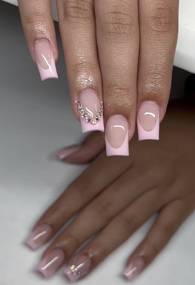 Light pink French tips with rhinestone accessories